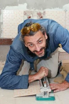 Tiler at work Stock Photos
