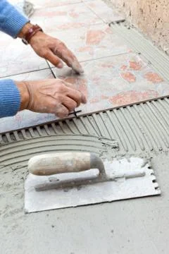 Tiler to work with tile flooring Stock Photos