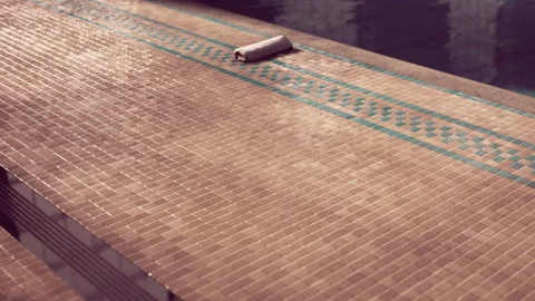 Tiles are arranged on a flat surface near a pool at a construction site Stock Footage 340016821