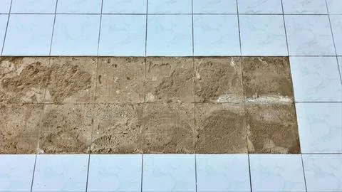 Tiles falling off the floor Foto stock