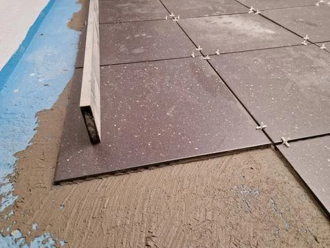 Tiles installation process in progress Stock Photos