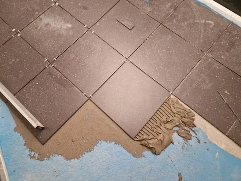 Tiles installation process in progress Stock Photos