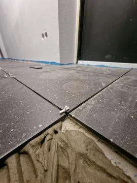 Tiles installation process in progress Stock Photos