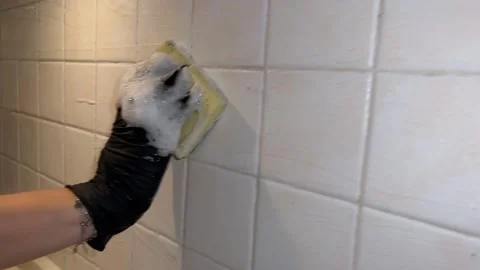 Tiles on the kitchen wall are washed Video stock 221784658