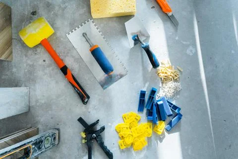 The tiling tools are on the floor. View from above. Stock Photos