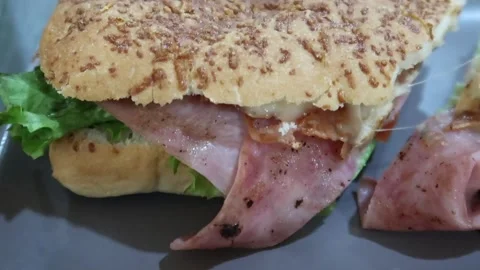 Till down of ham ciabatta with cheese and lettuce Stock Footage 263062353