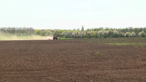 Tillage in the field with a tractor with a machine Stock Footage 147041414
