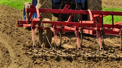Tillage in the field with a tractor with a machine Stock Footage 147041422