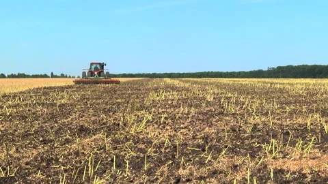 Tillage in the field with a tractor with a machine Stock Footage 147041427