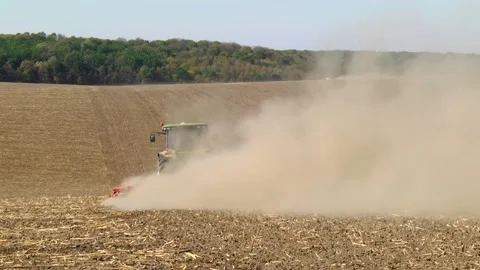 Tillage in the field with a tractor with a machine Stock Footage 147041431