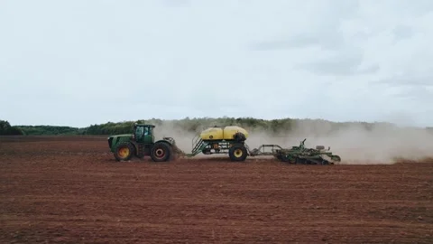 Tillage machine working in the field Stock Footage 165248552