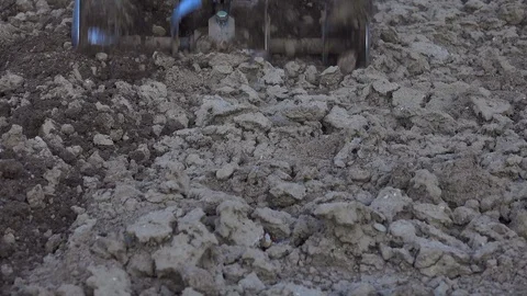 Tilling a garden with a rototiller in the spring. Stock Footage 123788679