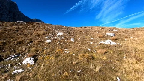 Tilt up Alps mountain edge covered with grass under Mangart peak Video stock 122211285