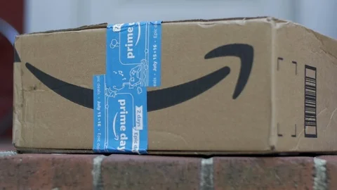 Tilt up From Amazon Box with Prime Day Tape to Front Door of Home Stock Footage 113284786
