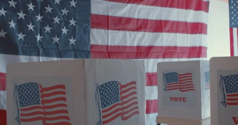Tilt up and down of American flags and voting booths Stock Footage 274923822