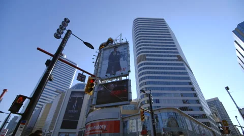 Tilt up and down of busy intersection at Yonge and Dundas Square Stock Footage 44267318