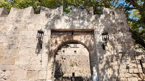 Tilt Up and Pan Right of Medieval Gate and Stone Walls, Rhodes Stock Footage 340575948