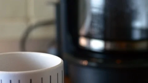 Tilt Up And Rack Focus From A Mug To The Coffee Macker, Kitchen Stock Footage 85556443