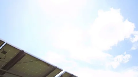 Tilt up from back of solar panels to sun Video stock 78042384
