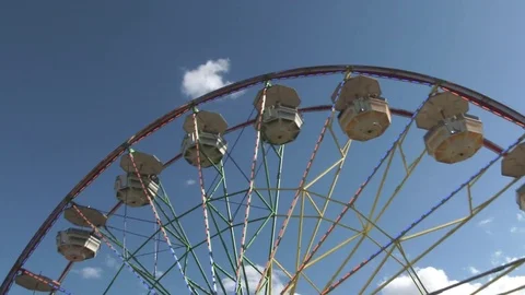 Tilt Up To Big Ferris Wheel Operating During The Day Video stock 76328898