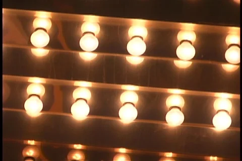 Tilt up blinking light bulbs Stock Footage 109180