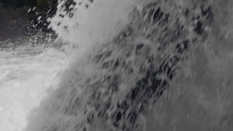 Tilt up from Bottom to Top of Powerful Waterfall Stock Footage 95989345