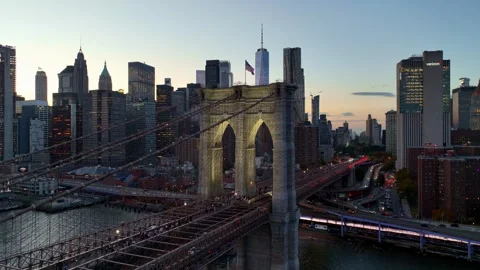 Tilt Up From the Brooklyn Bridge Tower with Lower Manhattan background at Dusk Video stock 345290342
