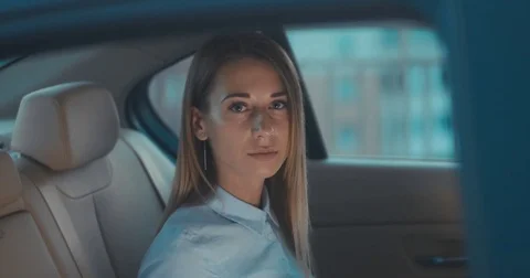 TILT UP Business lady  in a car, using her portable tablet computer Video stock 78697679