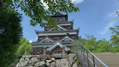Tilt up camera movement of the Hiroshima Castle, rebuilt after the atomic bom Stock Footage 195987073