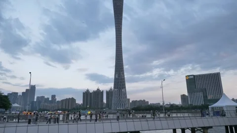 Tilt Up of Canton Tower Skyscraper with Partly Cloudy Sky before Sunset 4K Stock Footage 344185450