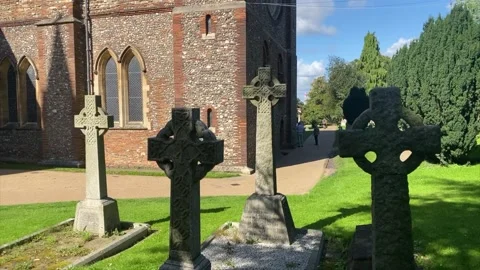 Tilt up from Celtic Crosses to the tower of St Albans cathedral 動画素材 140199713