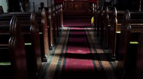 Tilt Up Church Aisle Red Carpet to Altar and Stained Glass Window Stock Footage