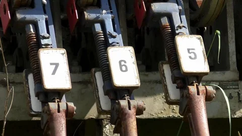 Tilt, Close up: Historic, rusty mechanical lever that was part of a signal box Stock Footage 89306460