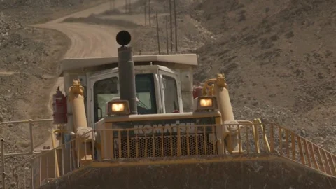 Tilt up of a construction vehicle working on construction site Stock Footage 312400459
