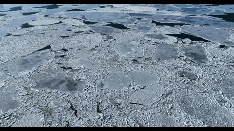 Tilt Up From Cracked Ice Texture To Hudson River Far Shore Aerial View Vídeo Stock 342647637