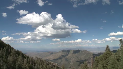 Tilt Up to Cumulus Clouds over Hot Arizona Desert on Summer Day Stock Footage 54714825