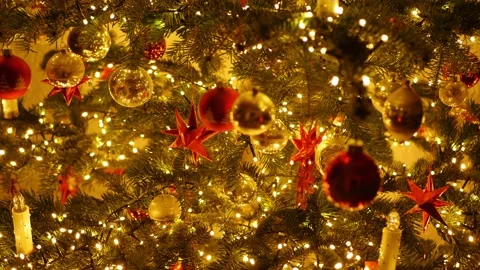 Tilt: Decorated christmas tree in private home, details, balls, stars, lights Stock Footage 230418997