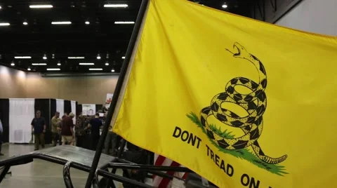 Tilt from Don't Tread on Me Flag to Zombie Apocalypse Car Stock Footage 64907260