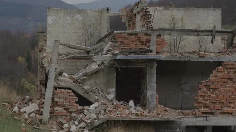 Tilt down Abandoned destroyed house broken bricks west of Sarajevo in 2008 Stock Footage 150492736