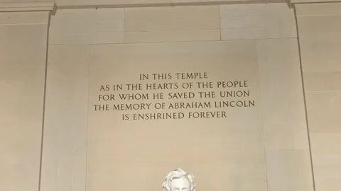 Tilt down on Abraham Lincoln statue at the Lincoln Memorial in Washington DC Video stock 134365080