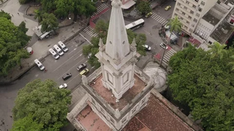 Tilt down aerial view of Chruch of Our Lady of Glory tower with sculptures at Video stock 251054024