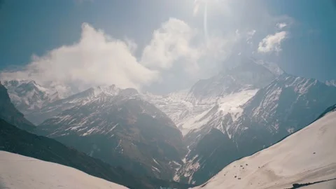 Tilt Down Against Huge Snow Mountain Landscape Stock Footage 154017554