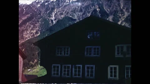 Tilt down from Alps to Building 1957 Video stock 48074576