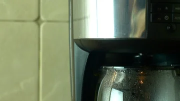 Tilt Down And Rack Focus From Coffee Maker To The Nearby Mug, Kitchen Stock Footage 85556511