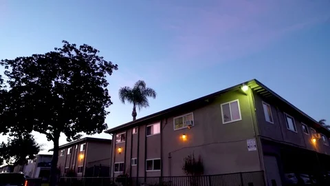 Tilt Down of Apartment Complex Evening in front of garage Video stock 92402875