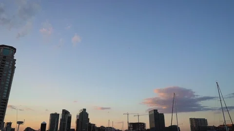 Tilt Down Baltimore City at Sunset from Harbor Stock Footage 96045814