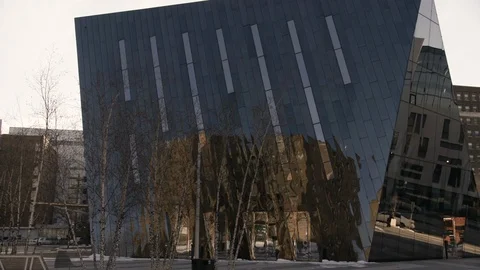 Tilt down onto Black Mirrored building high tech Stock Footage 89944849
