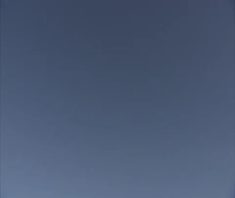 Tilt down from blue sky to construction of new CCTV building and Beijing skyline Stock Footage 86744993