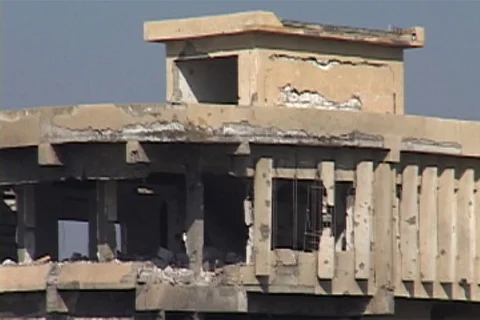Tilt down bombed building with its outer walls and windows missing Stock Footage 86753685