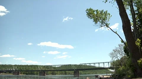 Tilt Down Bridge Over River Stock Footage 974591